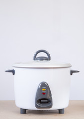 Electric rice cooker on white background