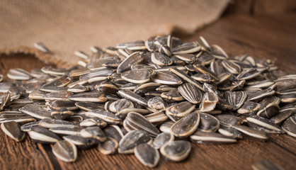 Sunflower seeds on a wooden background