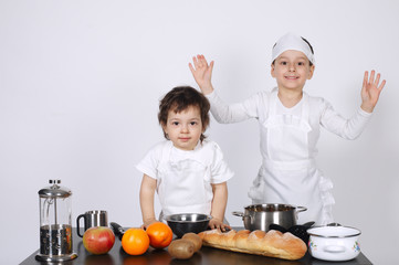 brothers making cake in the kitchen