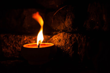 candle light on brick wall.