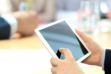 Close-up Of Businessman Analyzing data On Digital Tablet