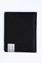 Black leather book on white backround.