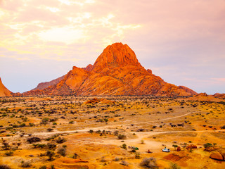 Spitzkoppe, aka Sptizkop - unique rock formation of pink granite in Damaraland landscape, Namibia,...