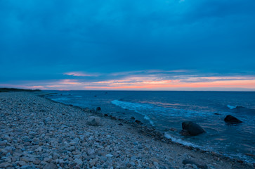 Sunset on the cobblestone beach of Montauk Point, Long Island.