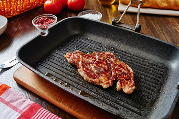 Cooked meat on grill pan