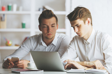 Businessmen using mobile phone