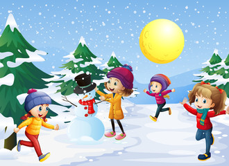 Fototapeta premium Kids playing in the snow on christmas
