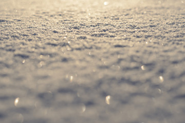 Background of natural snow texture at sunset