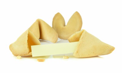 A broken Chinese fortune cookie with a blank message space on a white background