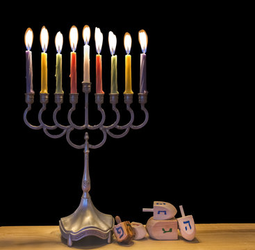 Jewish menorah with glitter lights of candles is traditional symbol for Jewish Hanukkah Holiday