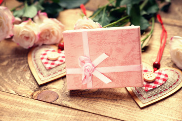 Roses, heart shapes and gift box 