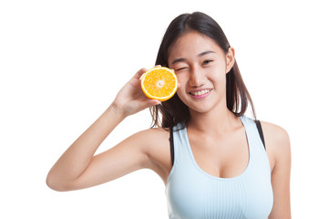 Asian healthy girl on diet with orange fruit.