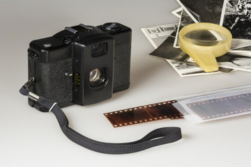 Foil old compact camera negatives and black-and-white photos