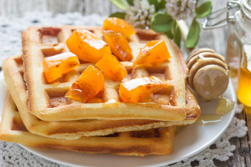 Waffles with persimmon and honey.