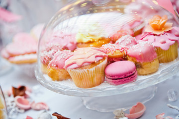 Pink cupcakes and macaroon dessert table