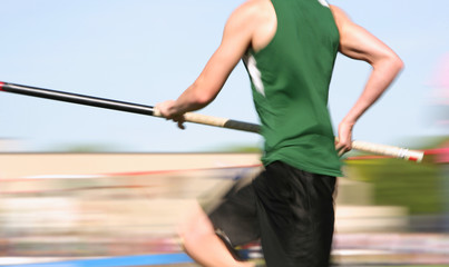 Polevaulter running down the runway (motion blur)
