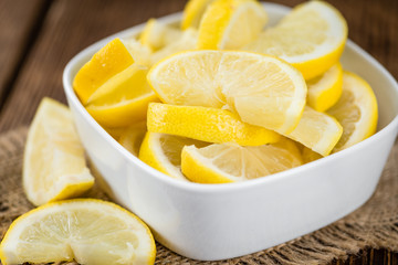 Fresh made Lemon Slices on a rustic background