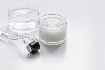 concept beautician desktop with mezoroller - mesotherapy on white background