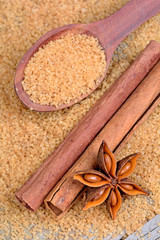Cinnamon with anise star and sugar on table