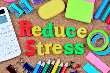 Reduce stress words on cork background