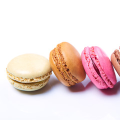Colorful french macaroons on a white background