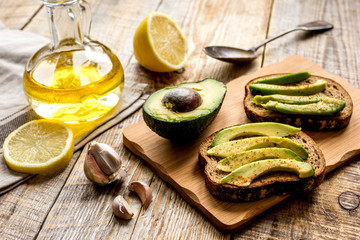 making sandwiches with avocado healthy organic food top view