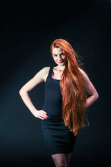 Beauty ginger Girl Portrait. Healthy Long Red Hair. Beautiful Yo