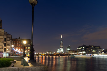 Obraz premium LONDON, ENGLAND - JUNE 17 2016: Night Panorama of Southwark Bridge, The Shard skyscraper and Thames River, London, United Kingdom