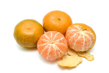 peeled tangerine, clementine or mandarin orange fruit isolated on white background