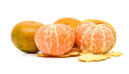 peeled tangerine, clementine or mandarin orange fruit isolated on white background