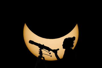 Woman with telescope Safe Solar Eclipse observation