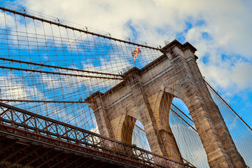 Naklejka premium Clouds above Brooklyn Bridge, wide angle view - New York