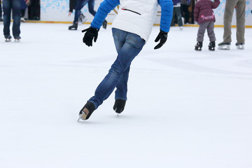 people skating on the ice rink