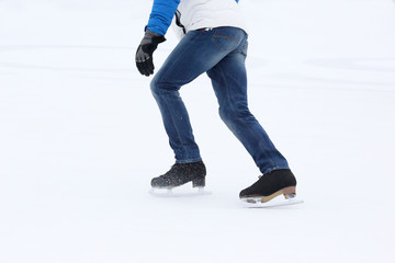 Fototapeta na wymiar people skating on the ice rink