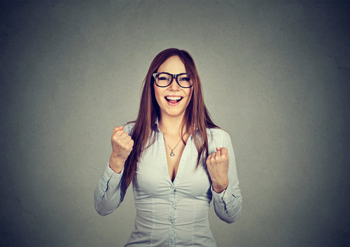 woman with fists pumped celebrating success