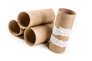 Several empty toilet paper rolls isolated on a white background