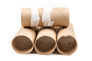 Several empty toilet paper rolls isolated on a white background