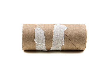 Single empty toilet paper roll isolated on a white background
