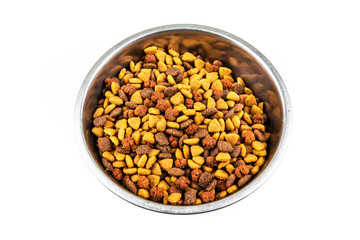 Stainless steel bowl of dog food isolated on a white background