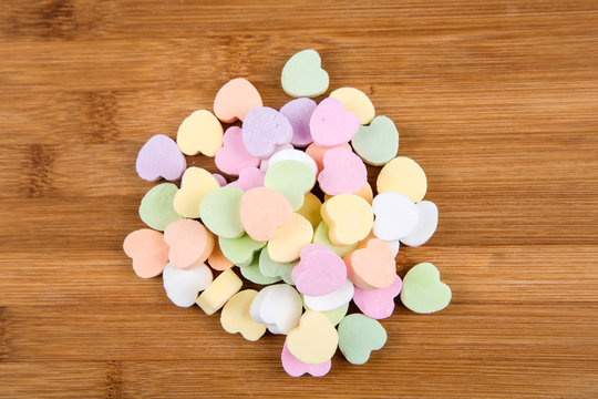 Blank Valentine Candy Hearts Isolated On A Wood Background