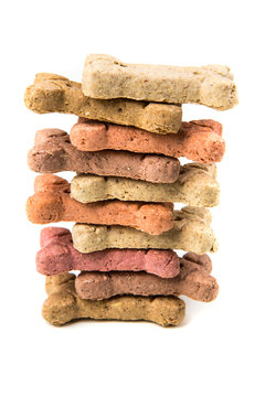 Stack Of Multicolored Dog Biscuits Isolated On A White Background