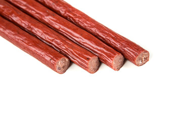 Pepperoni snack sticks isolated on a white background