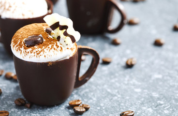 Coffee mousse with whipped cream in chocolate cup