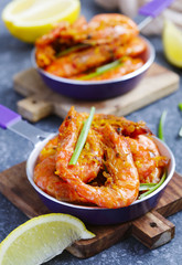 Shrimps roasted on frying pan with lemon and garlic
