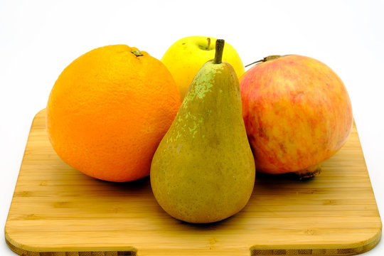 Seasonal fruit of Spain, pomegrenade, pear, apple and orange