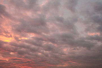 Sun rays and dark clouds at sunset