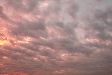 Sun rays and dark clouds at sunset