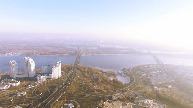 
4K Aerial. Over city winter urban landscape with buildings and river . Lateral flight
