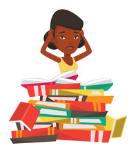 Student sitting in huge pile of books.