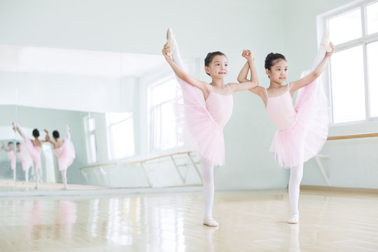 Little Girls Practicing Ballet At Dance Studio